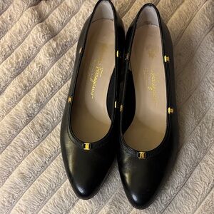 Salvatore Ferragamo Black Flats with Gold Accents